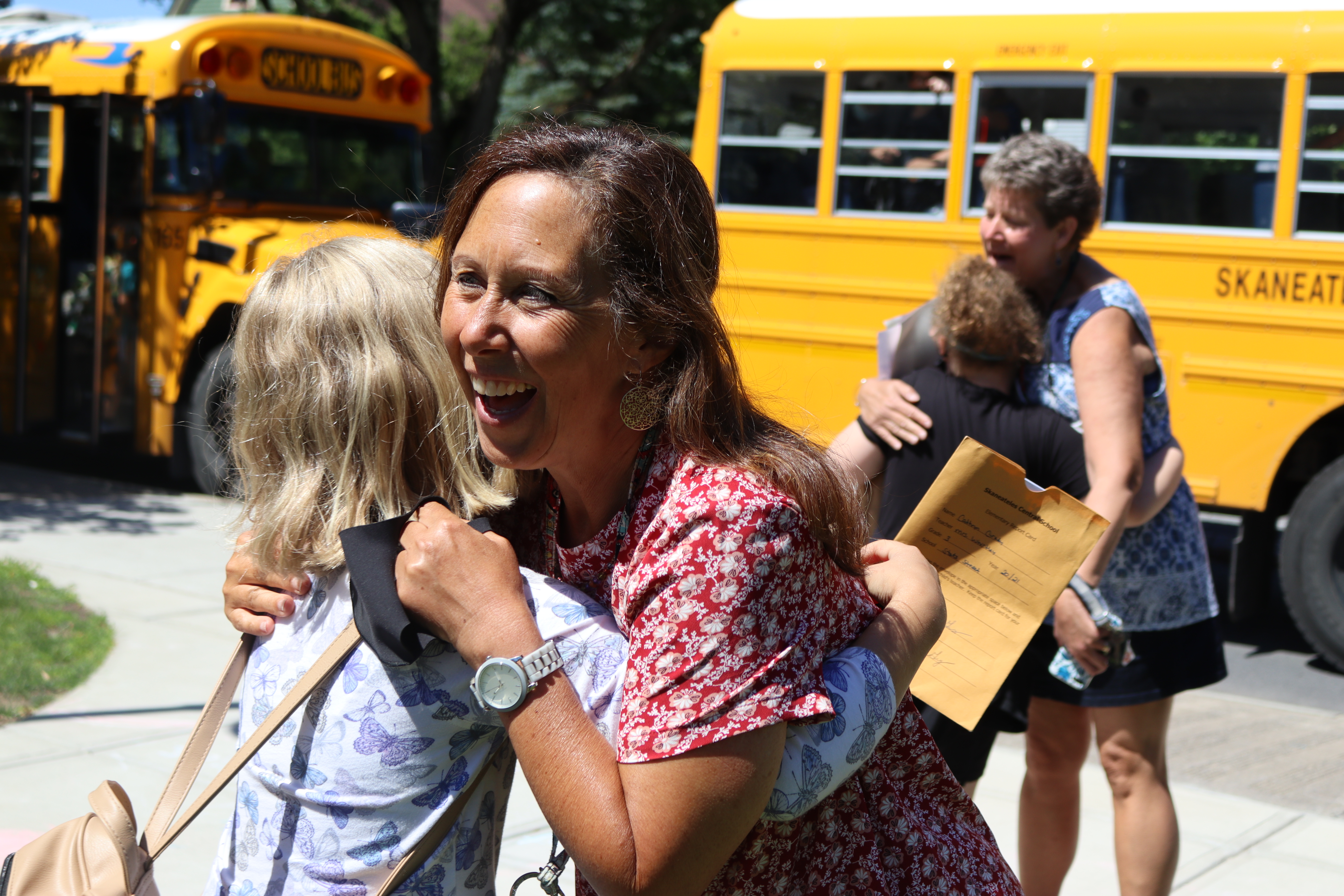 A State Street student hugs a teacher goodbye.