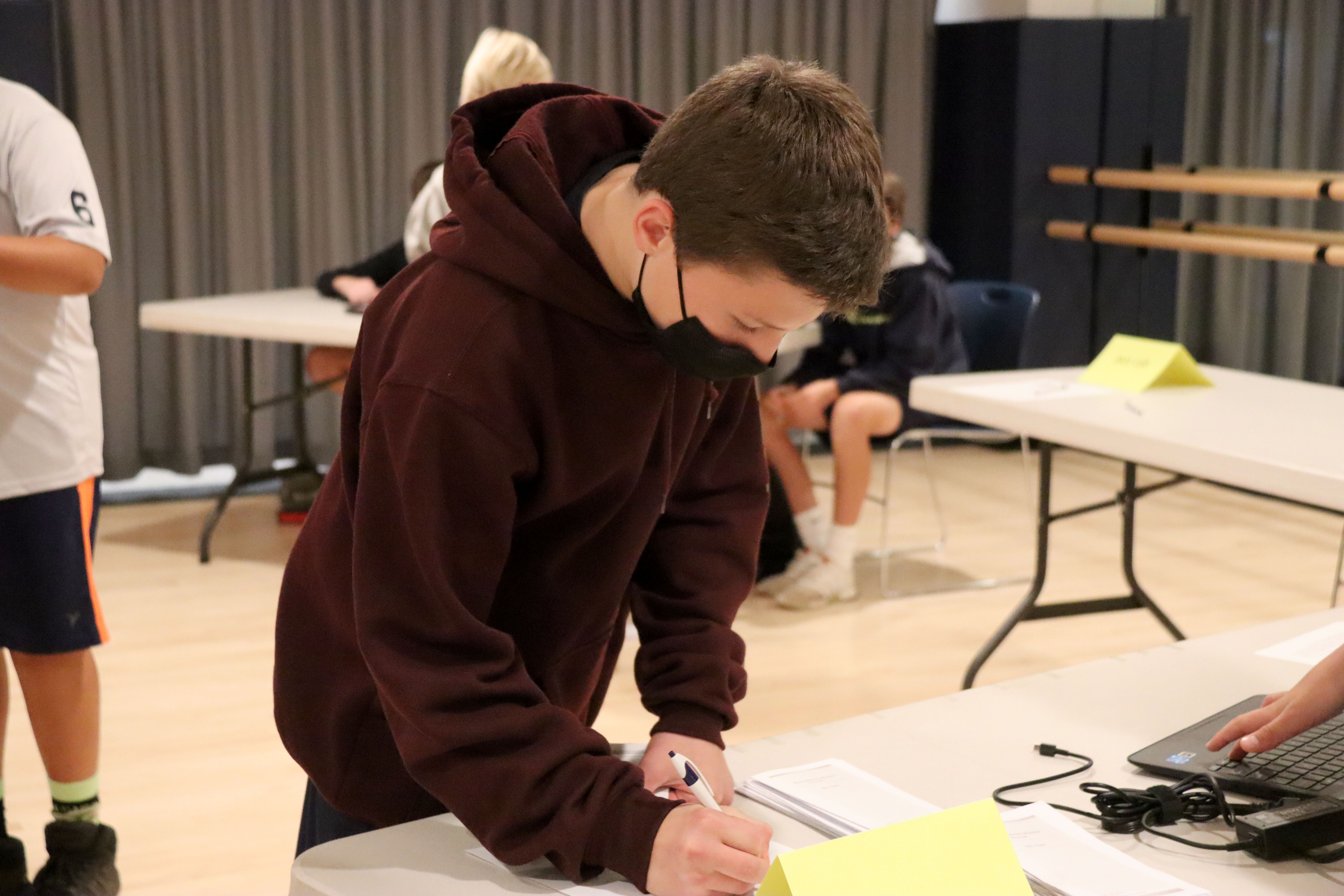 A student signs up for a club.