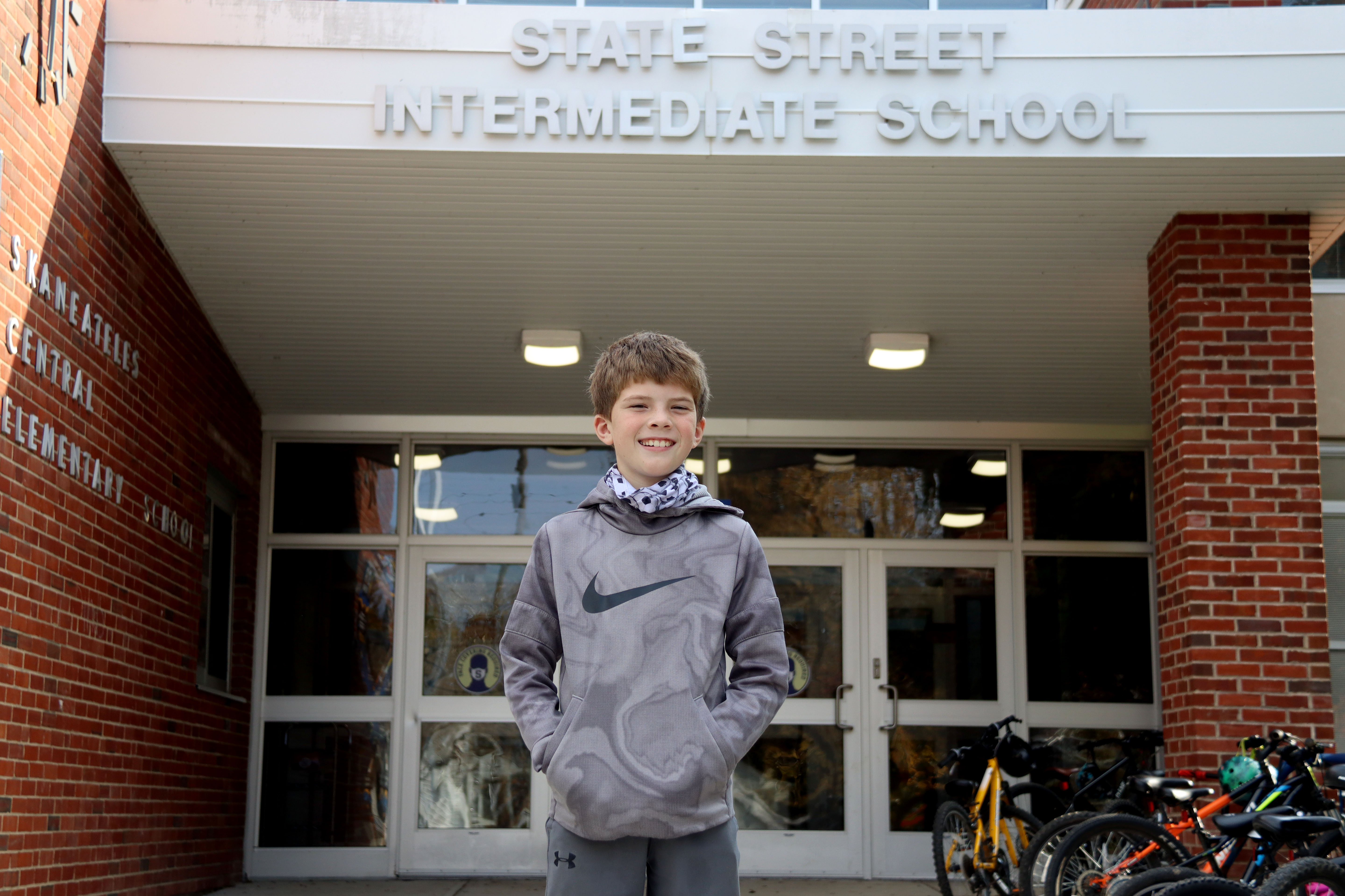 Luke Moore stands in front of State Street Elementary