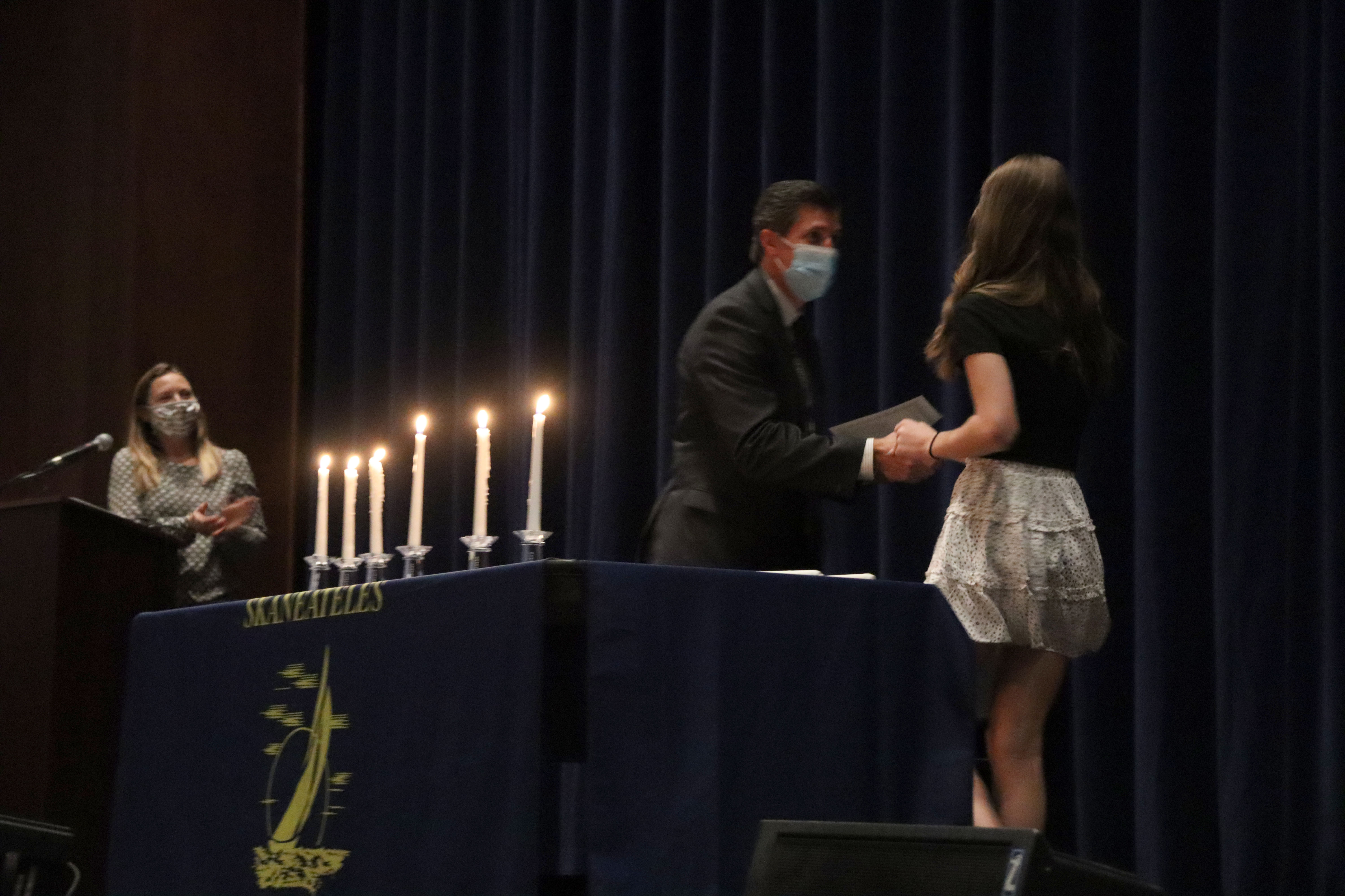 New NJHS inductee receives a certificate