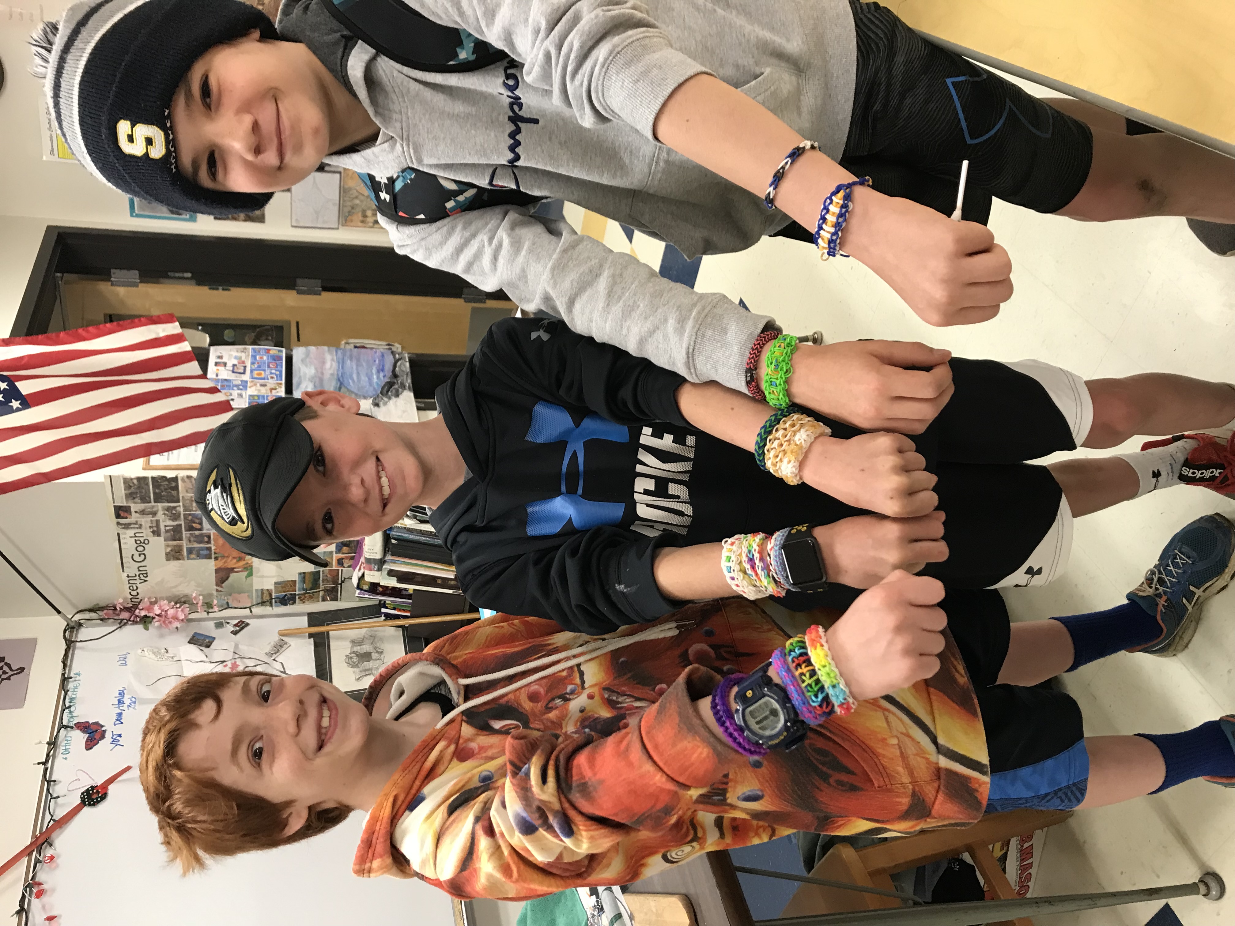 Isaac Franks, William Clancy and their friend Leo Lang show off Monster Bands
