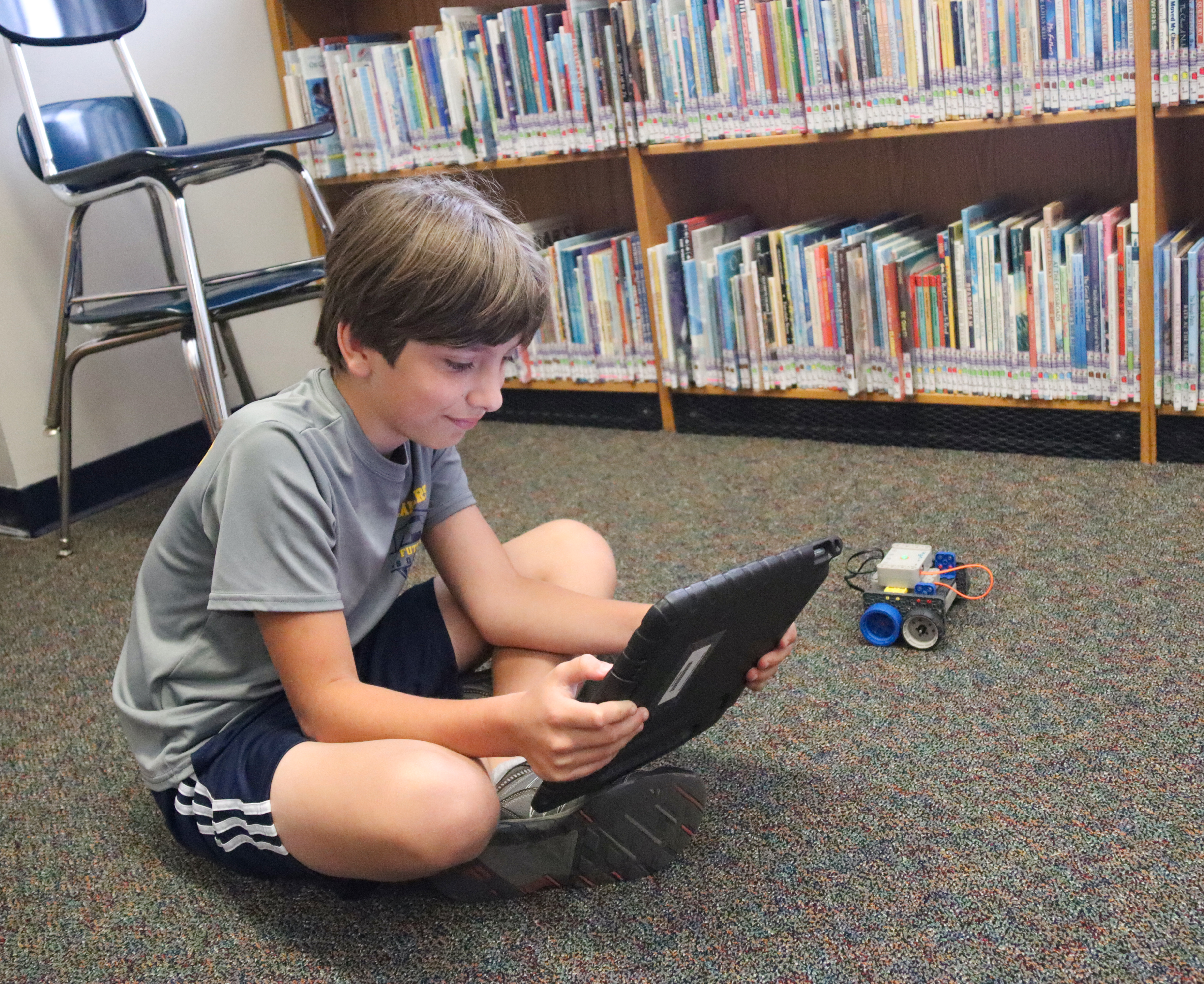 A student configures his robot at Coding Camp.