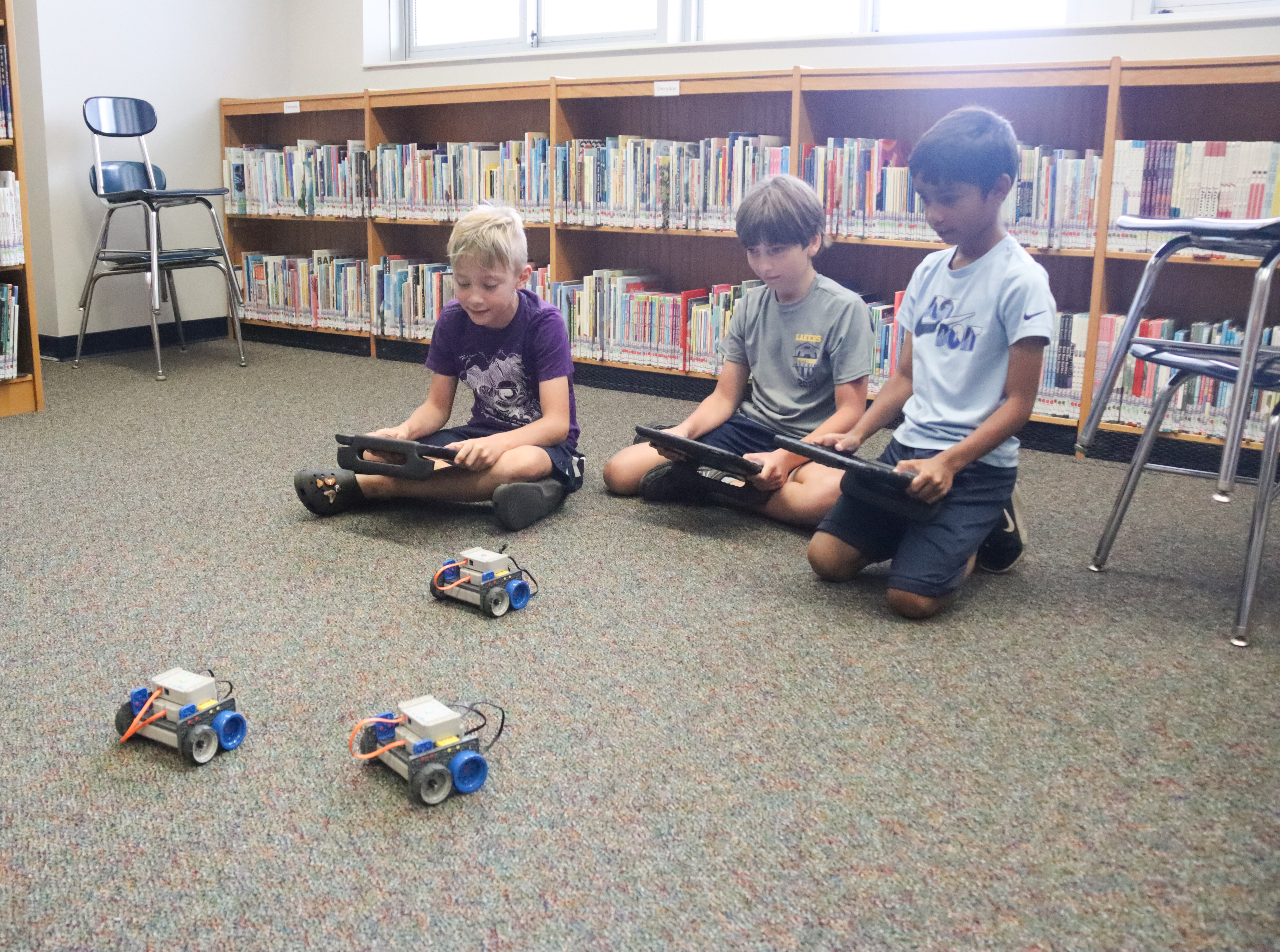 Students move their robots.