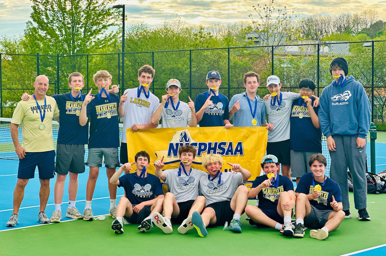 Boys Tennis Team poses after winning regional championship