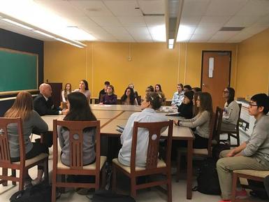 Dr. Coronoa addresses a group of Skaneateles High School students.