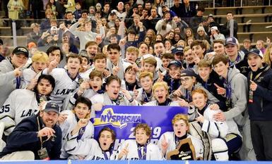 The Lakers pose as state champions.