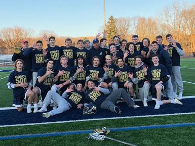 The Boys Lacrosse team celebrates Coach Ron Doctor's 500th win.