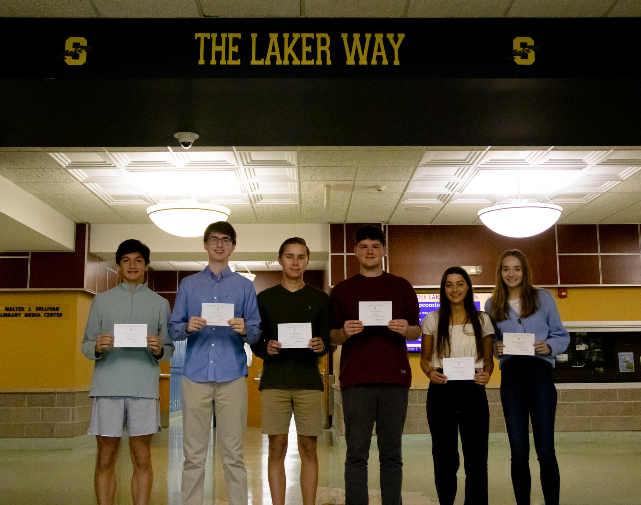 Six students display their awards at Skaneateles High School