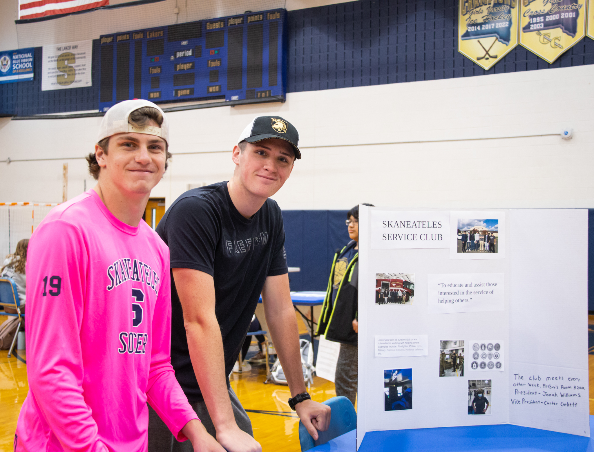 Members of the Service Club display information.