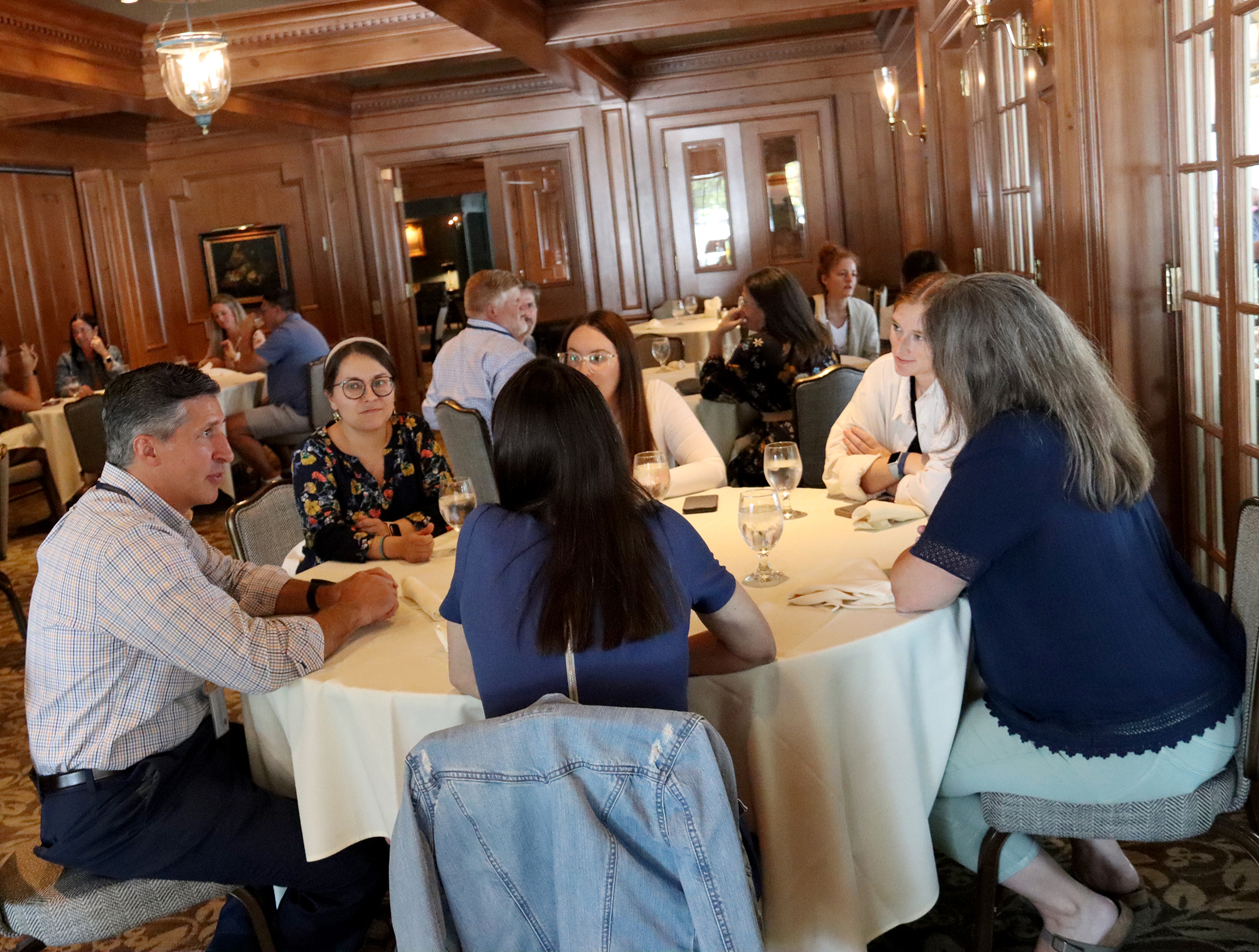 New hires have lunch with administrators at the Sherwood Inn during orientation